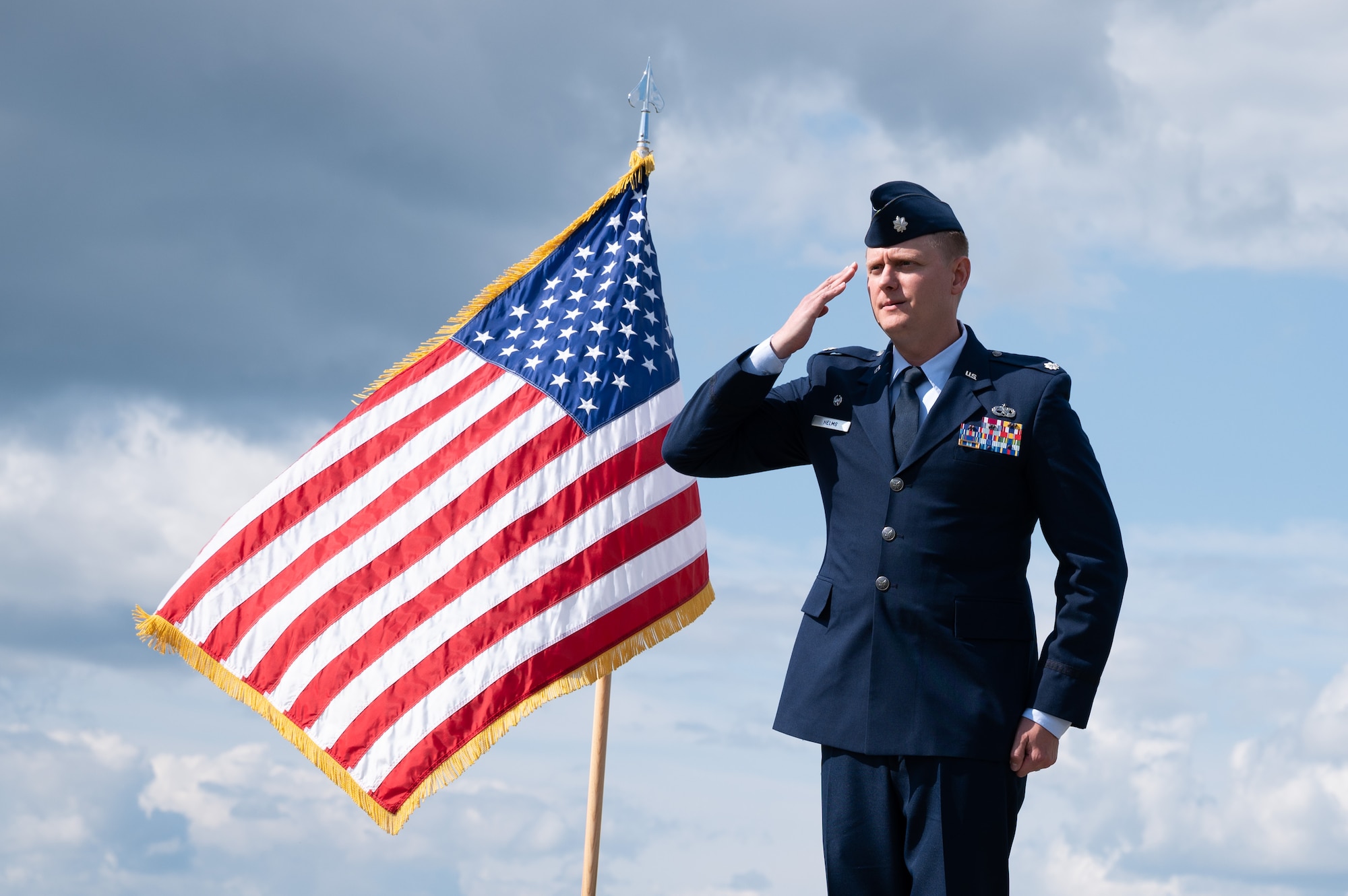 U.S. Air Force Lt. Col. Cory Helms, the 354th Munitions Squadron commander, renders the first squadron salute during an assumption of command ceremony on Eielson Air Force Base, Alaska, July 26, 2021.