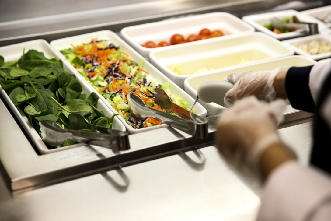 A photo shows food on a salad bar.