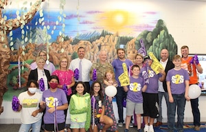 Col. Daniel Diehl, 509th Bomb Wing commander, celebrates the win of the Elite Team of the Year award with the Whiteman Elementary students and staff at Whiteman Air Force Base, Missouri, July 21, 2021. The Military Child Education Coalition® announced Whiteman Elementary as the winning school of the organization’s annual Student 2 Student® Team of the Year competition, which recognizes school teams' contribution assisting and integrating military students in their classrooms. (Courtesy photo by Knob Noster School District)