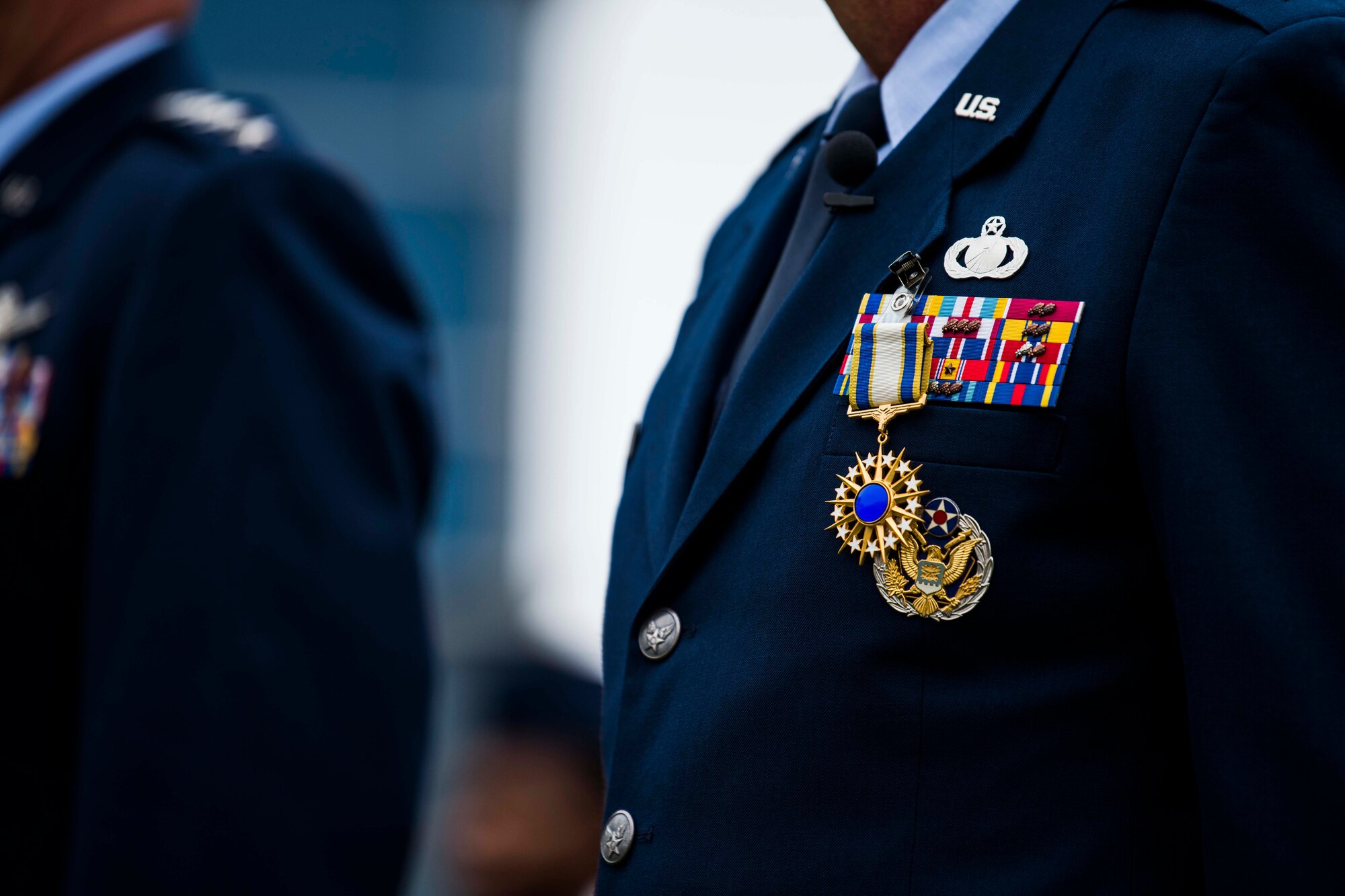 The Distinguished Service Medal rests upon the uniform of U.S. Air Force Lt. Gen. John F. Thompson, Space and Missile Systems Center commander and Department of the Air Force Program Executive Officer for Space, after being presented by U.S. Space Force Gen. John W. “Jay” Raymond, Chief of Space Operations, during Thompson’s retirement ceremony at Los Angeles Air Force Base, California, July 27, 2021. The Air Force Distinguished Service Medal is presented to Airmen and Guardians to recognize distinguished and exceptionally meritorious service to the U.S. while serving in a duty or position of great responsibility. This is Thompson’s second time receiving this medal. (U.S. Space Force photo by Staff Sgt. Luke Kitterman)