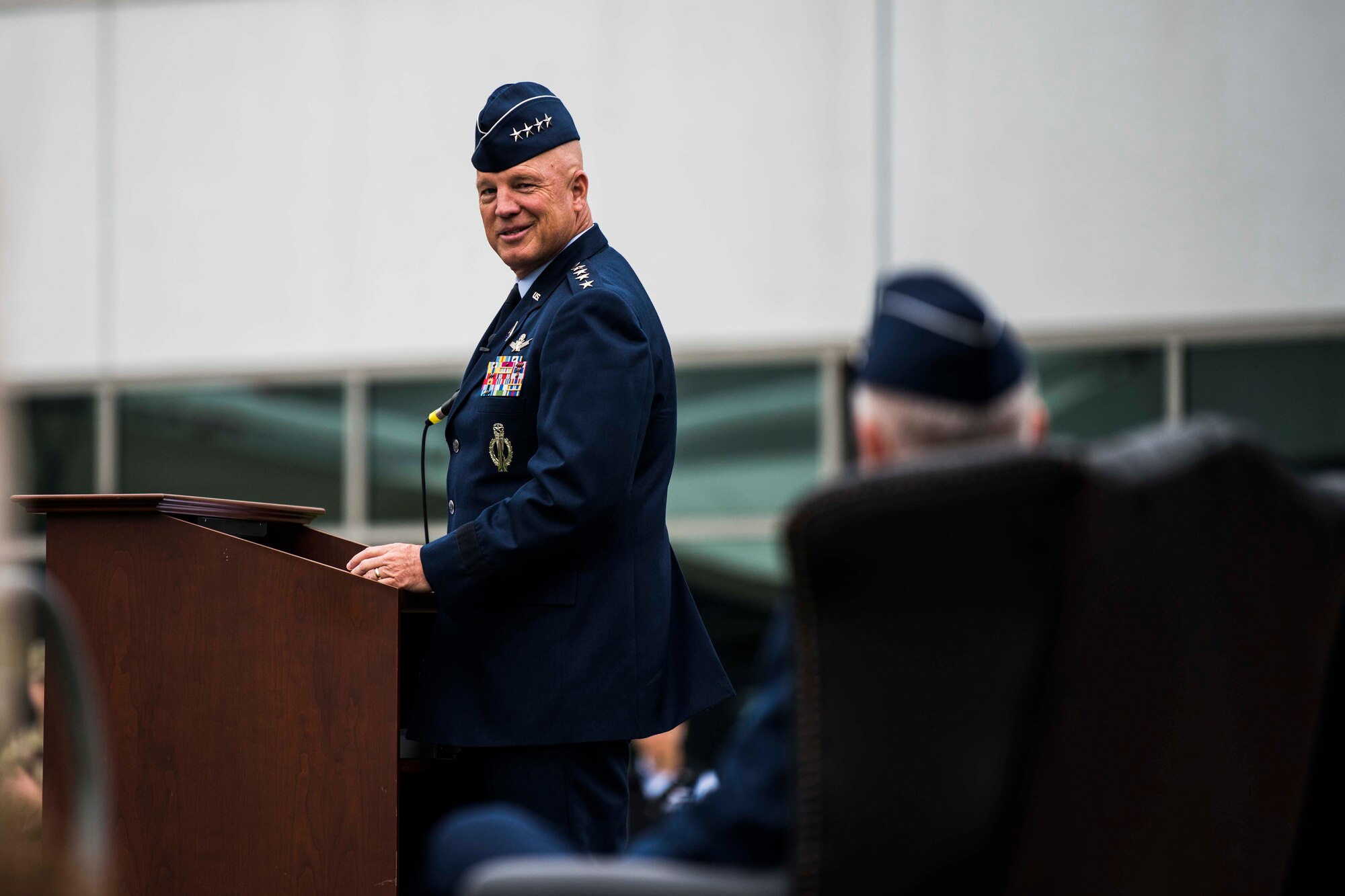 U.S. Space Force Gen. John W. “Jay” Raymond, Chief of Space Operations, looks back at U.S. Air Force Lt. Gen. John F. Thompson, Space and Missile Systems Center commander and Department of the Air Force Program Executive Officer for Space, during his speech at Thompson’s retirement ceremony at Los Angeles Air Force Base, California, July 27, 2021. Raymond was the Presiding Official for the ceremony and spoke on the many accomplishments Thompson has achieved over his career. (U.S. Space Force photo by Staff Sgt. Luke Kitterman)