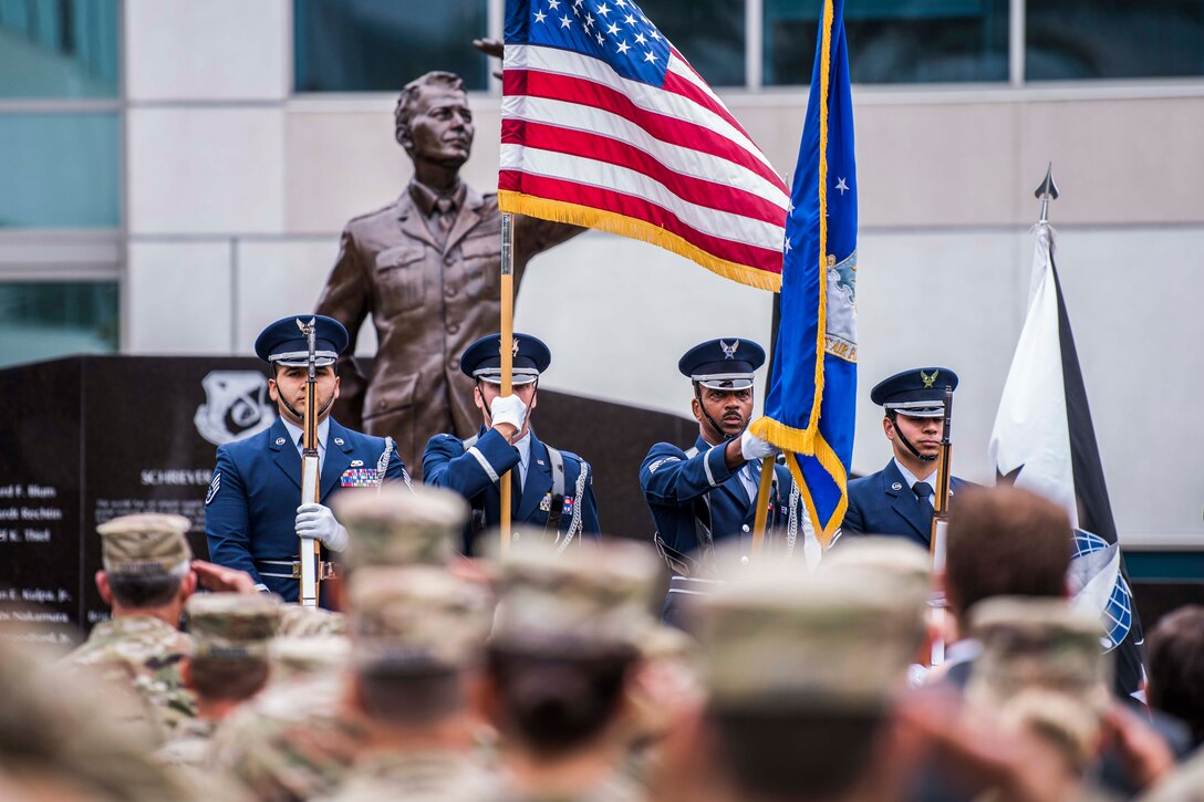 The Los Angeles Air Force Base Honor Guard team posts the colors during a retirement ceremony for U.S. Air Force Lt. Gen. John F. Thompson, Space and Missile Systems Center commander and Department of the Air Force Program Executive Officer for Space at Los Angeles Air Force Base, California on July 27, 2021. Starting his career after graduating from the U.S. Air Force Academy in 1984, Thompson has dedicated 36 years of service to the U.S. Air Force. (U.S. Space Force photo by Staff Sgt. Luke Kitterman)