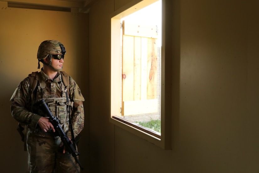 Pfc. Nicholas Krainik, a psychological operations specialist with the 393rd Psychological Operations Company, conducts scenario-based training with his team at Fort McCoy, Wis., July 16, 2021.