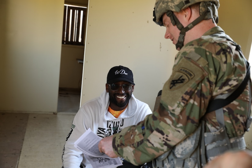 Staff Sgt. Joseph Boulard, a psychological operations specialist with the 393rd Psychological Operations Company, conducts scenario-based training with his team at Fort McCoy, Wis., July 16, 2021.