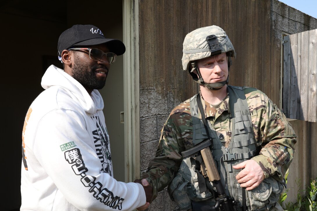 Staff Sgt. Joseph Boulard, a psychological operations specialist with the 393rd Psychological Operations Company, conducts a scenario-based training with his team at Fort McCoy, Wis., July 16, 2021.