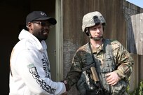 Staff Sgt. Joseph Boulard, a psychological operations specialist with the 393rd Psychological Operations Company, conducts a scenario-based training with his team at Fort McCoy, Wis., July 16, 2021.
