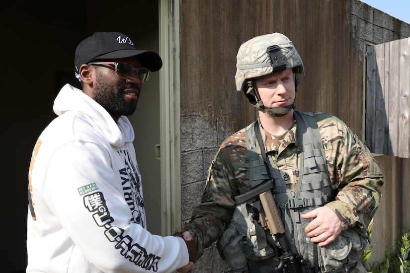 Staff Sgt. Joseph Boulard, a psychological operations specialist with the 393rd Psychological Operations Company, conducts a scenario-based training with his team at Fort McCoy, Wis., July 16, 2021.