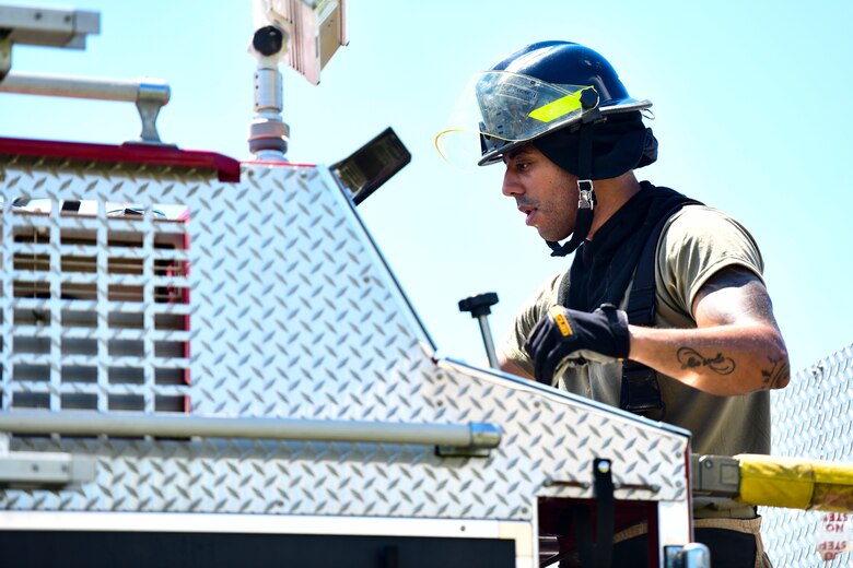An Airman operates a fire truck.
