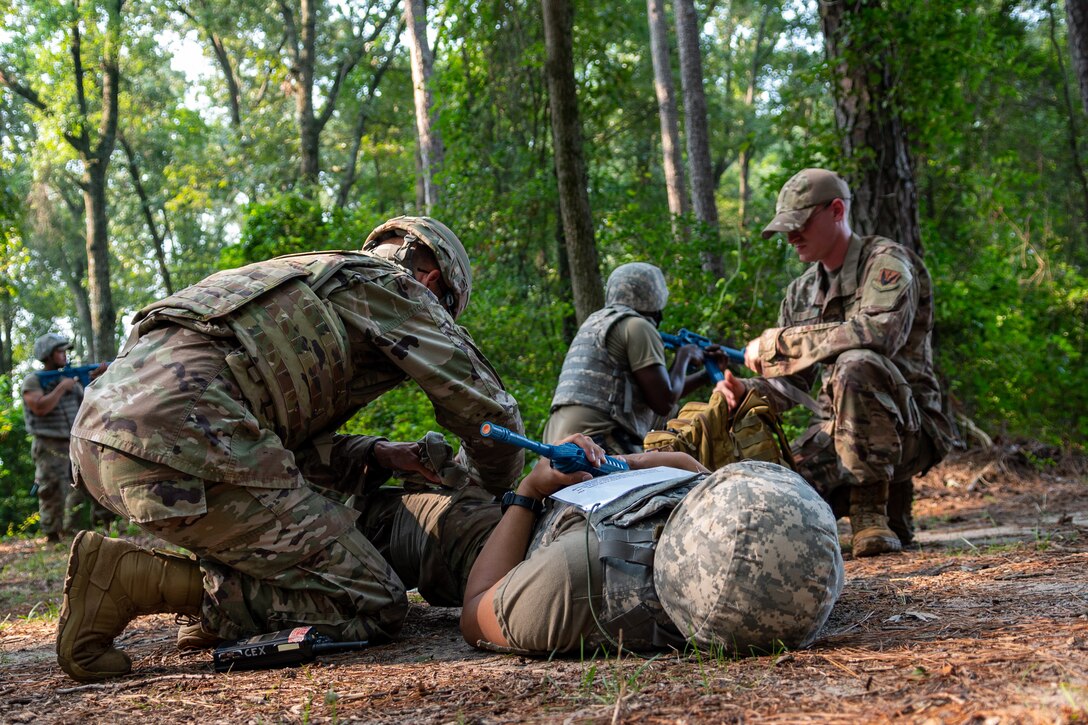Airmen from the 4th Civil Engineer Squadron practice tactical combat casualty care as part of the Prime Base Engineer Emergency Force, or Prime BEEF, program at Seymour Johnson Air Force Base, North Carolina, July 22, 2021. TCCC is used to treat casualties in combat to improve their likelihood of surviving until the injured can receive proper medical care. (U.S. Air Force photo by Airman 1st Class David Lynn)