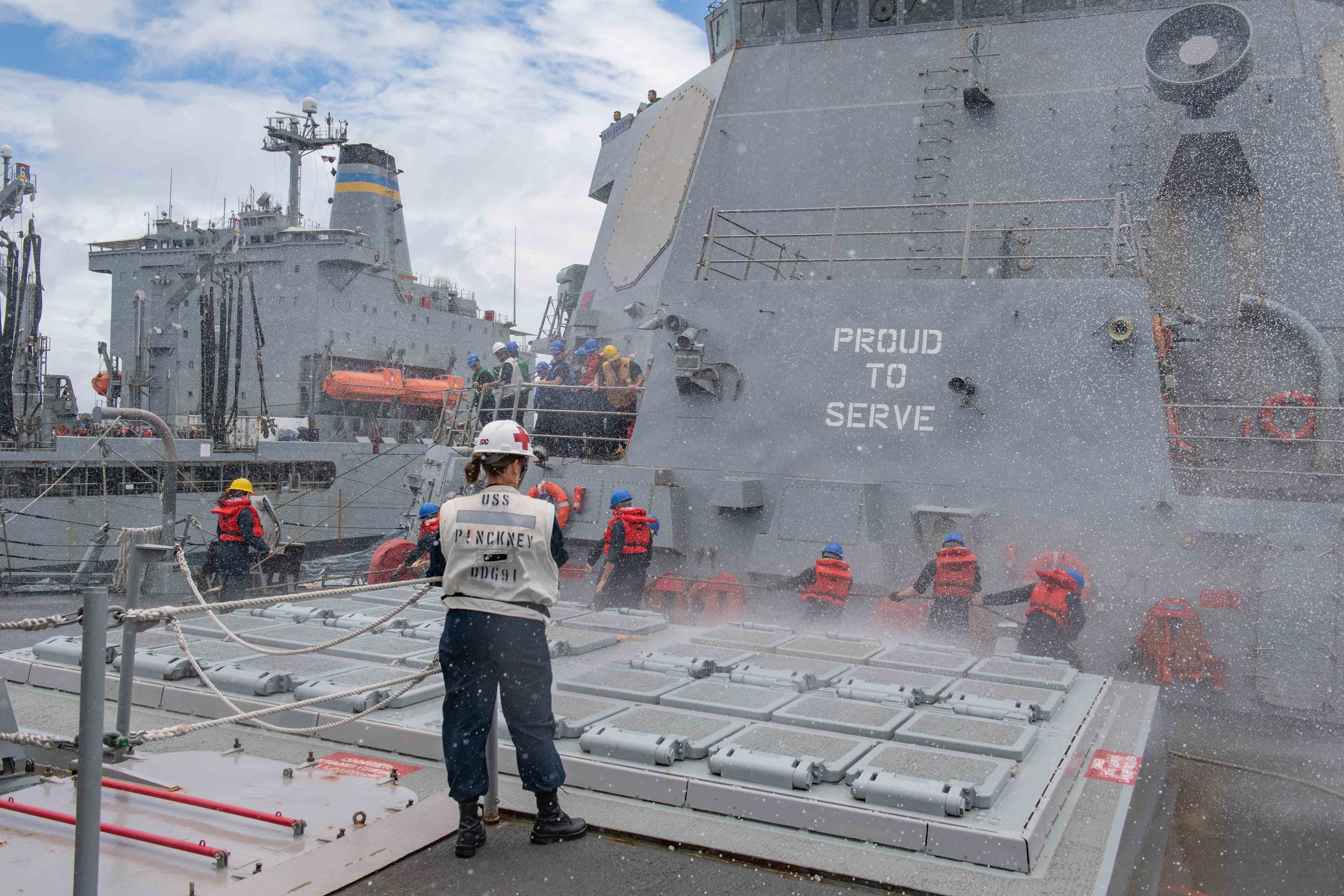 Sailors aboard Arleigh Burke-class guided-missile destroyer USS Pinckney (DDG 91) conduct a replenishment-at-sea with Henry J. Kaiser class fleet replenishment oiler USNS Tippecanoe (T-AO 199).