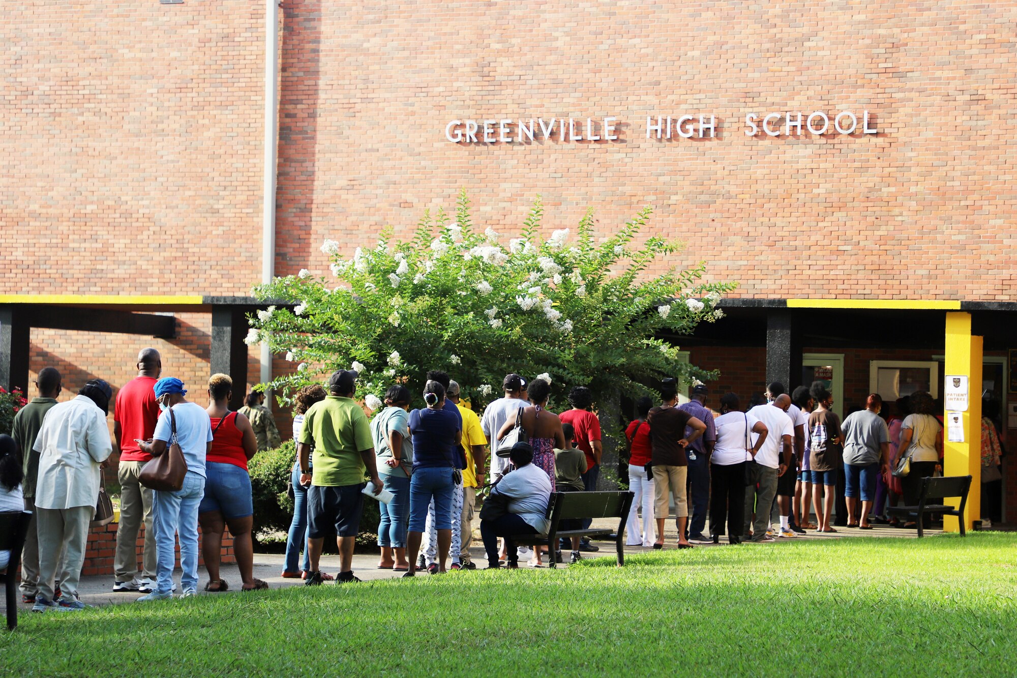 Community members line up outside of Greenville High School for the no-cost medical, dental and optometry services being provided at Delta Wellness 2021. (U.S. Air Force photo by 1st Lt. Briell Zweygardt)