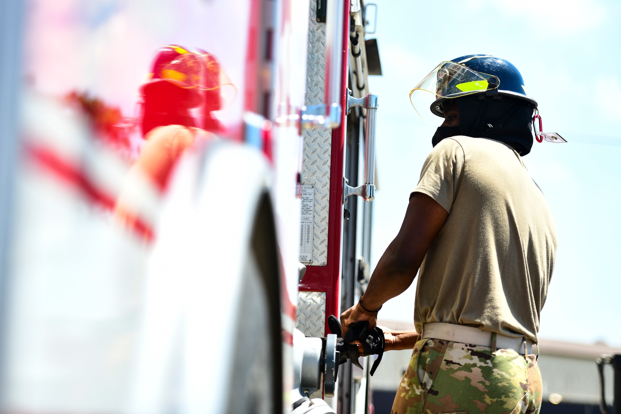 An Airman puts on gloves.