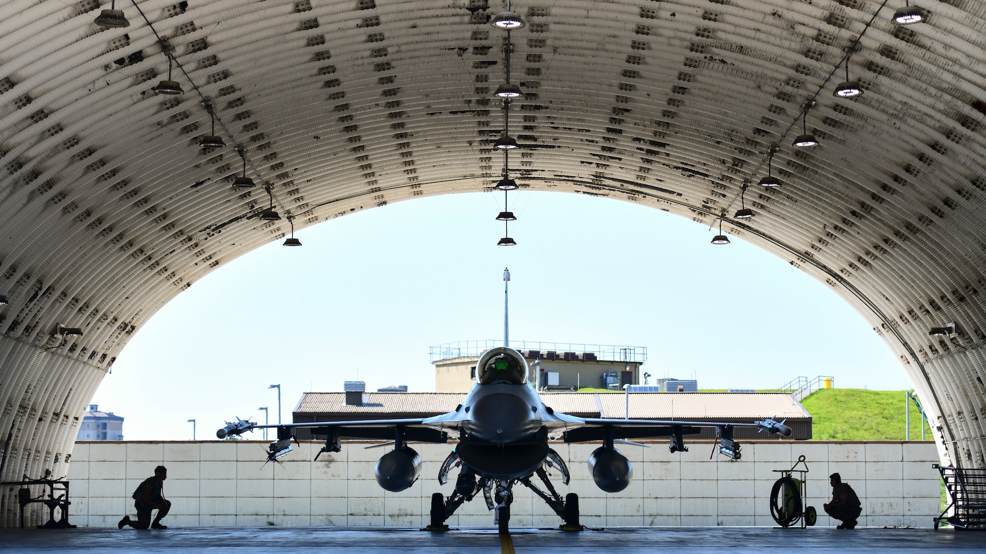 Maintainers inspect a jet.