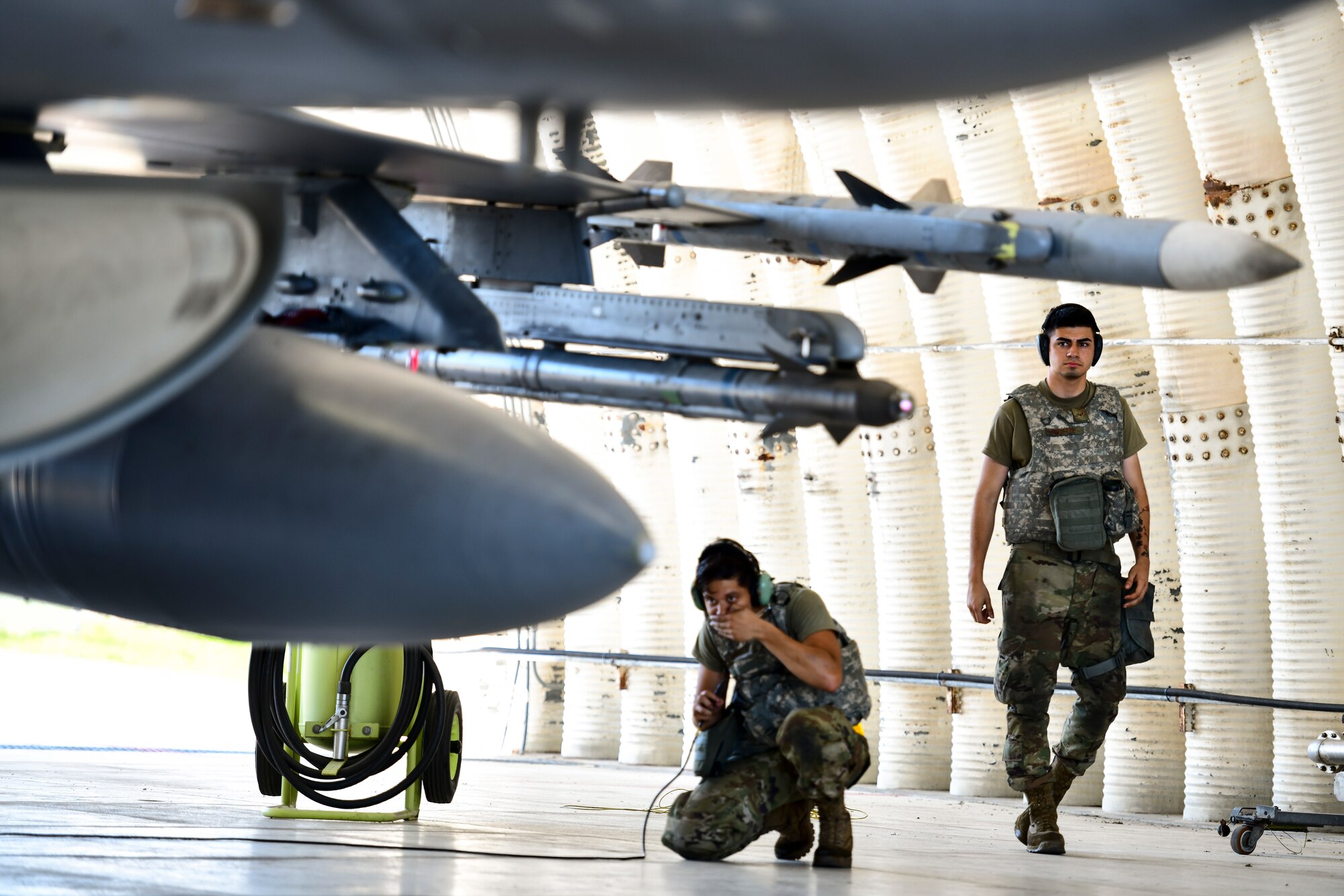 Maintainers inspect a jet.