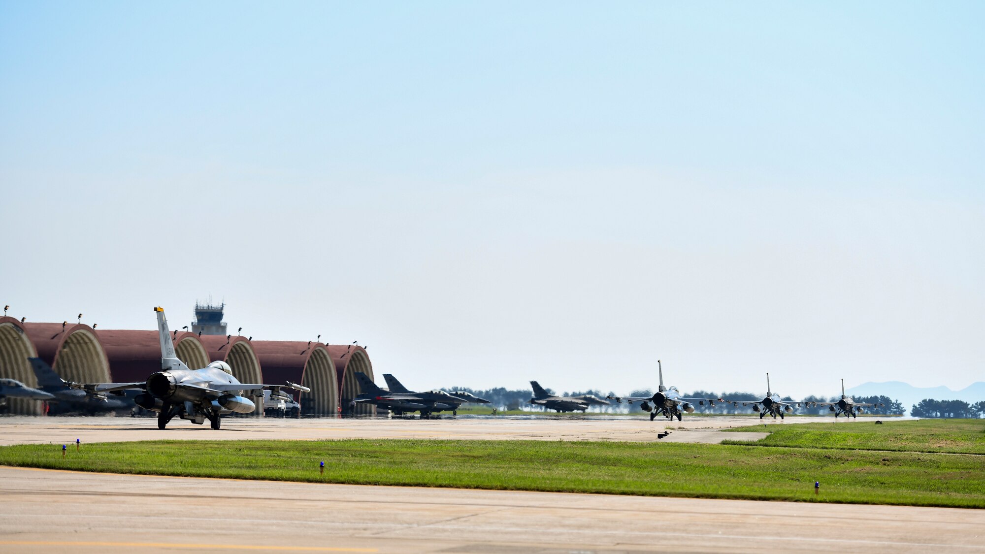 Jets prepare to takeoff.