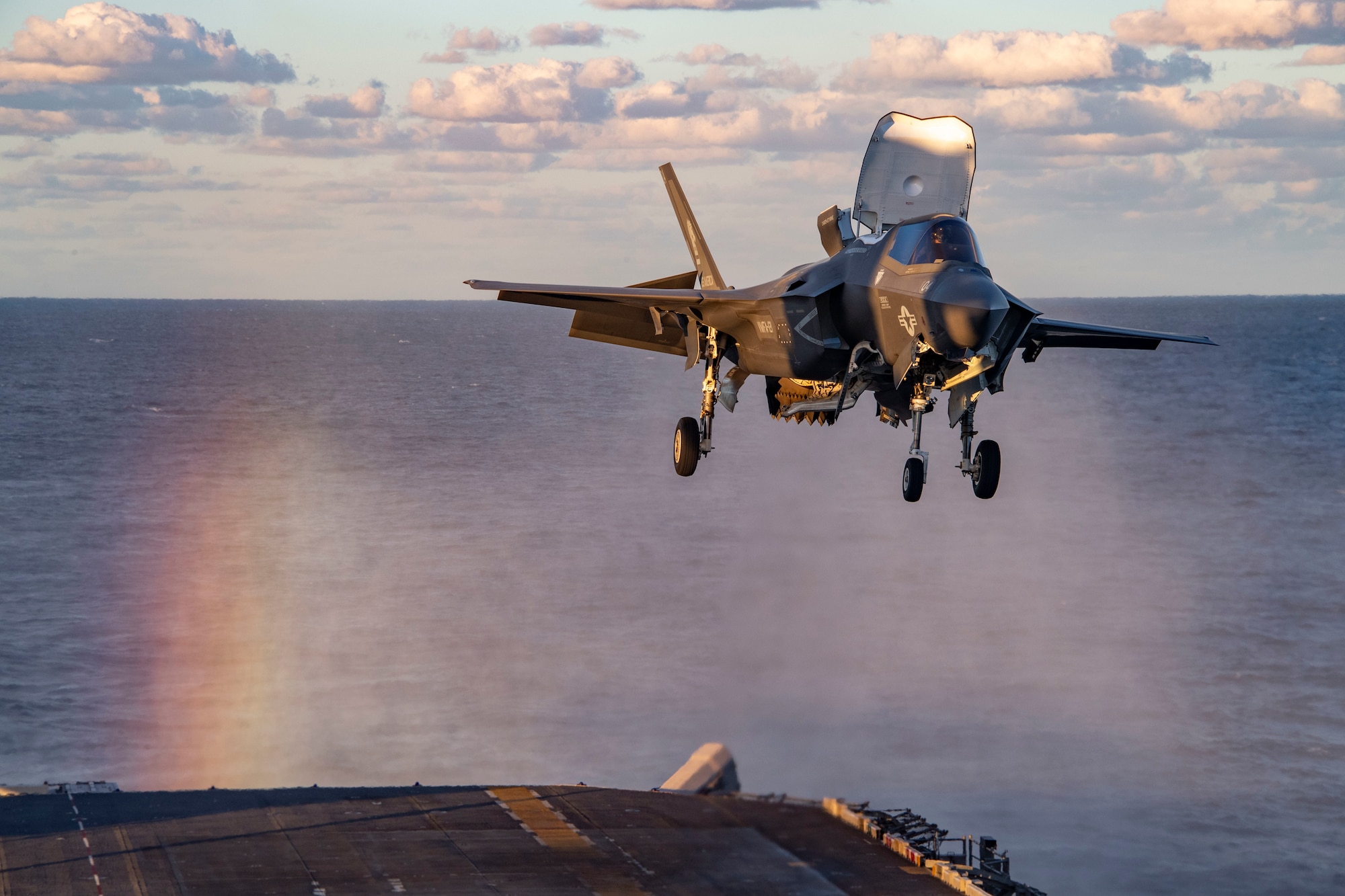 An F-35B Lightning fighter aircraft from the 31st Marine Expeditionary Unit lands on the flight deck of the forward-deployed amphibious assault ship USS America (LHA 6) during Exercise Talisman Sabre 21.