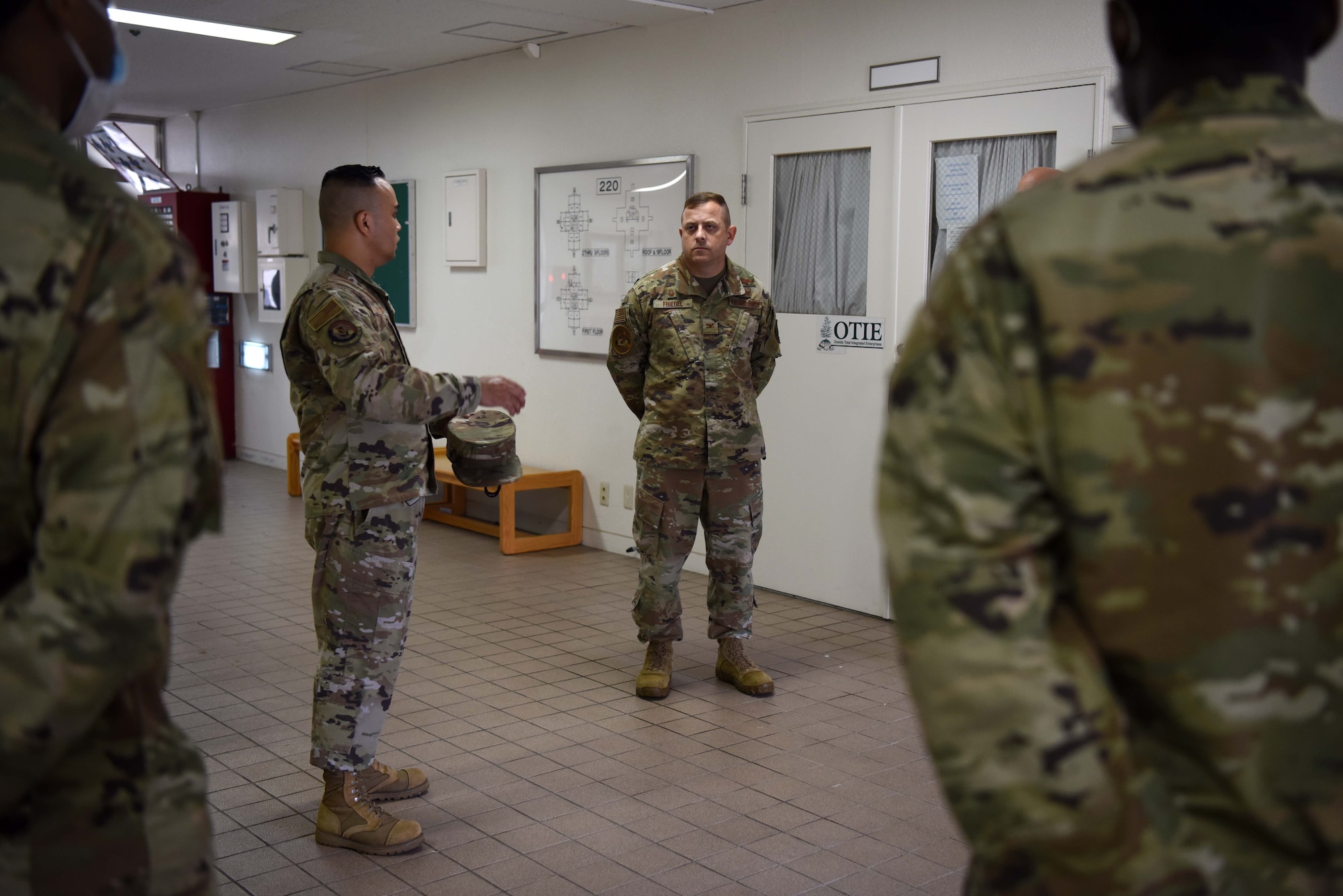 Individuals speak inside buildings about improvements