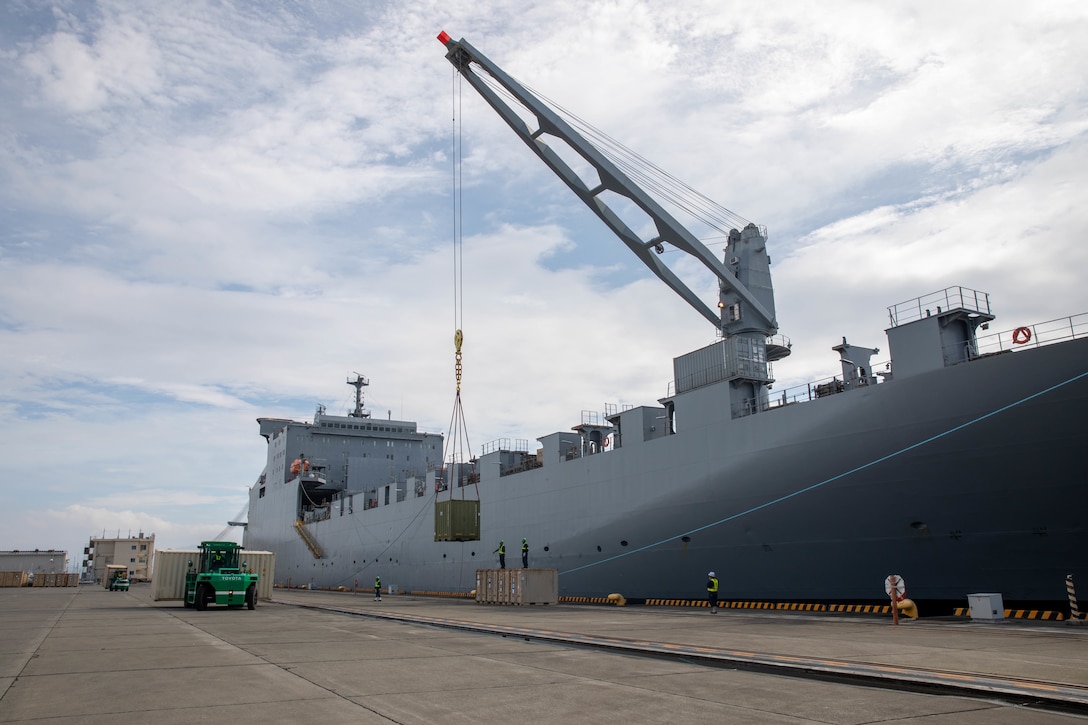 Personnel with the 836th Transport Battalion, Surface Deployment and Distribution Command (SDDC), load cargo onto the USNS Fisher aboard Marine Corps Air Station (MCAS) Iwakuni, July 19, 2021, as part of ORIENT SHEILD 21-2 (OS21-2). OS 21-2 is the largest field training exercise in Japan between the U.S. Army and the Japanese Ground Self-Defense Force (JGSDF), including approximately 1,400 U.S. personnel and 1,600 JGSDF personnel. MCAS Iwakuni is uniquely positioned to support such an exercise because of the station’s co-located airfield and deep-water port. (U.S. Marine Corps photo by Lance Cpl. Darien Wright)