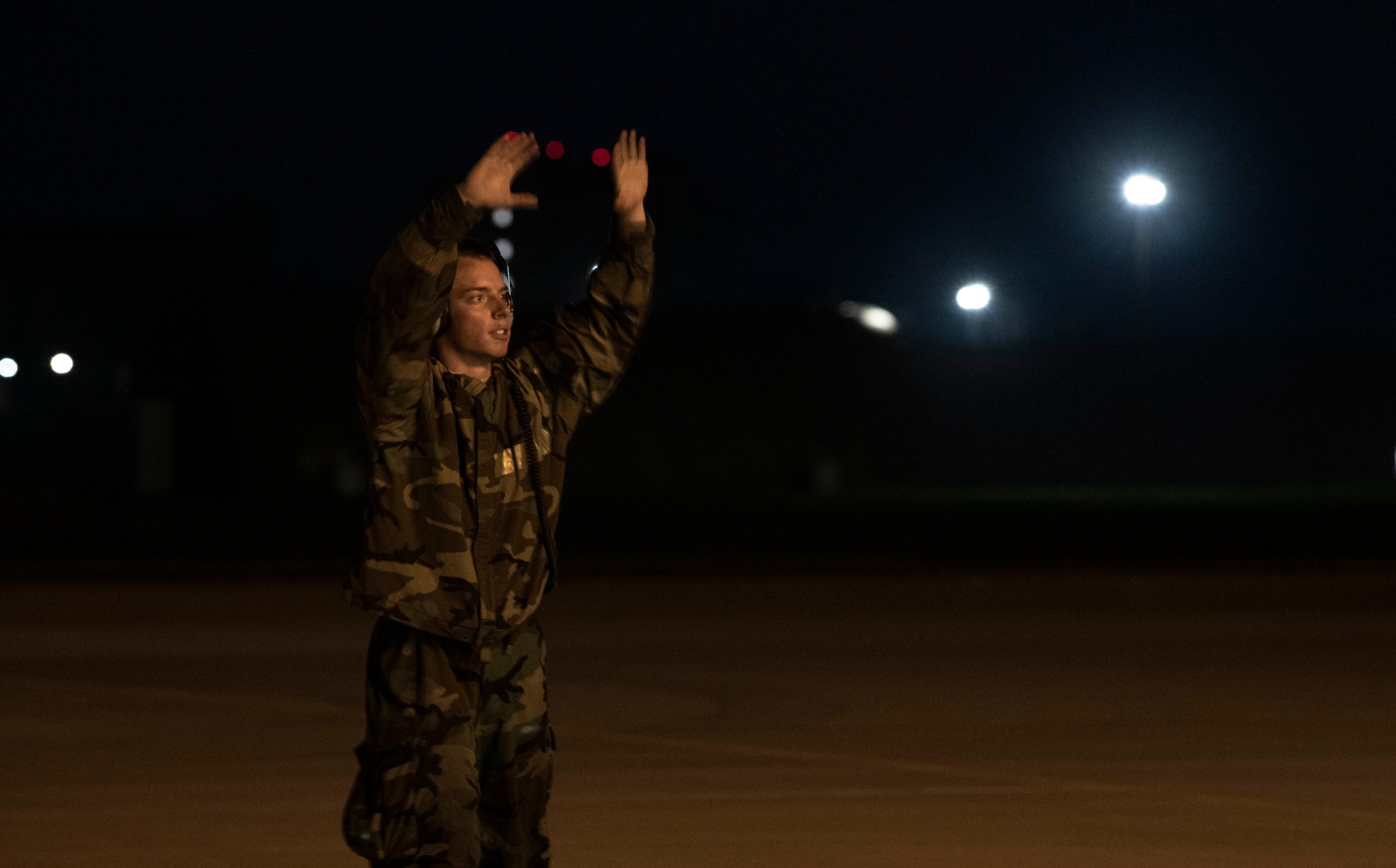 Airman marshals aircraft