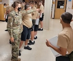 Idaho Army National Guard Pfc. Riley Ward directs candidates at the Idaho Youth ChalleNGe Academy in Pierce, Idaho, July 21, 2021.