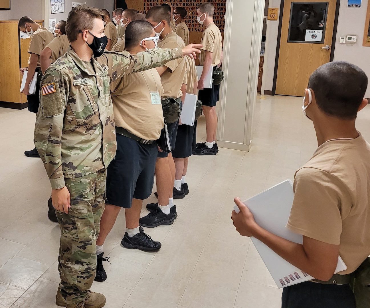 Idaho Army National Guard Pfc. Riley Ward directs candidates at the Idaho Youth ChalleNGe Academy in Pierce, Idaho, July 21, 2021.