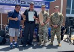 Virginia Army National Guard recruiters participate in Local Heroes Day July 17, 2021, in Virginia Beach, Virginia. Along with local first responders, the recruiters from the  accepted a proclamation and an engraved surfboard from Virginia Beach Mayor Bobby Dyer at the event. (Courtesy Photo)