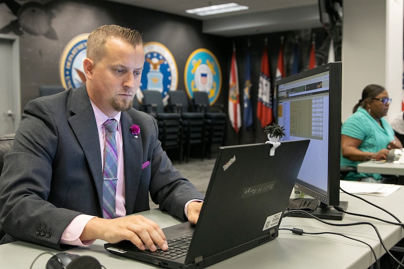 Scott Ferge, left, and Melanie Jackson, both U.S. Army Financial Management Command systems accountants, work during the Army’s mock fiscal yearend closeout at the Maj. Gen. Emmett J. Bean Federal Center July 19. Mock yearend is an exercise designed to prepare USAFMCOM and its partners for the fiscal yearend closeout and financial statement preparation at the start of October. (U.S. Army photo by Mark R. W. Orders-Woempner)