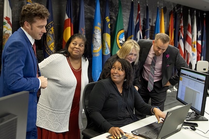 From left to right, Spencer Powell, Joyce Dean, Eddra Peoples, Cynthia Price and Scott Ferge, U.S. Army Financial Management Command systems accountants, talk through a problem during the Army’s mock fiscal yearend closeout at the Maj. Gen. Emmett J. Bean Federal Center July 19. Mock yearend is an exercise designed to prepare USAFMCOM and its partners for the fiscal yearend closeout and financial statement preparation at the start of October. (U.S. Army photo by Mark R. W. Orders-Woempner)