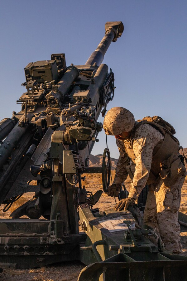 A Marine with Oscar Battery, 5th Battalion, 14th Marines, 4th Marine Division, initiates howitzer elevation during Integrated Training Exercise (ITX) 4-21 at Marine Corps Air Ground Combat Center, Twentynine Palms, California on July 26, 2021. Reserve Marines and Sailors have come together from across the country as an integrated Marine Air-Ground Task Force to take part in a live-fire, combined arms exercise that will better prepare Marine Forces Reserve in its mission to augment and reinforce the Active Component. (U.S. Marine Corps photo by Lance Cpl. David Intriago)