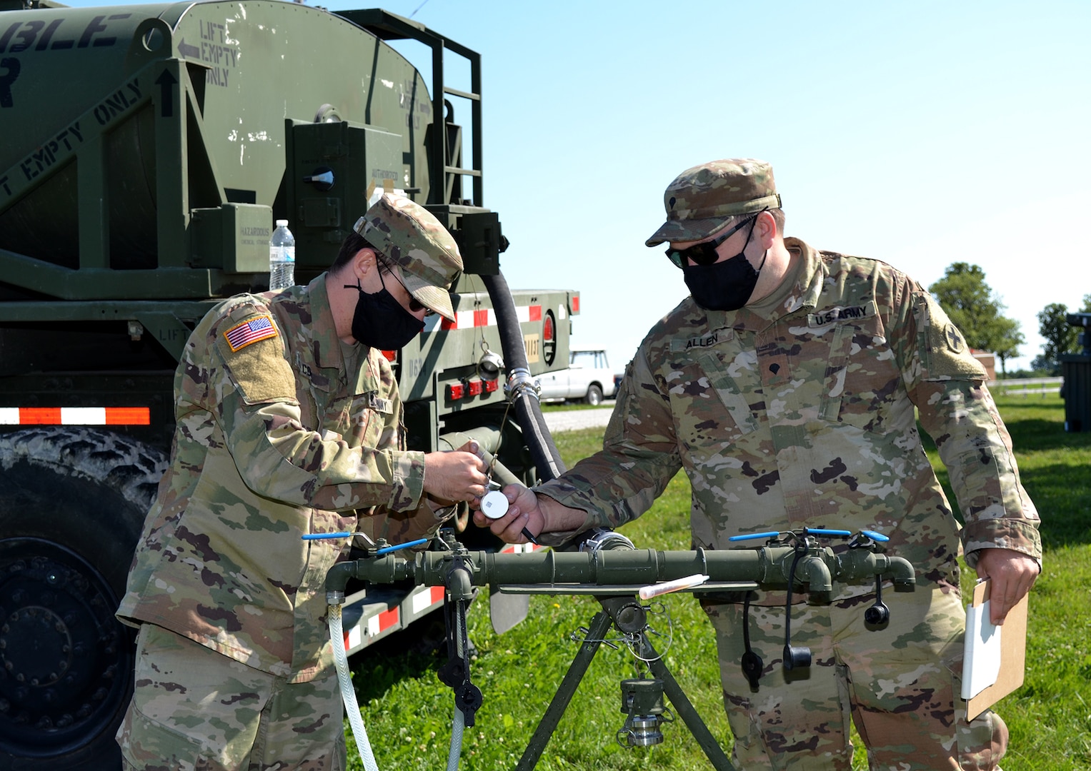 Cpl. Shane Cook, of Tuscola, Illinois, and Spc. Theordore Allen, of Lincoln, Illinois, both with Company C, 634th Brigade Support Battalion, perform a water test during the Region IV Phillip A. Connelly competition Aug. 4, 2020, at Marseilles Training Center for Company D, 634th Brigade Support Battalion, based in Galva, Illinois.