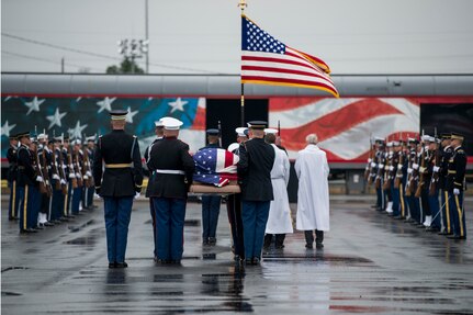 The Joint Forces Honor Guard carry the casket of former President George H.W. Bush to a funeral car during a departure ceremony at Union Pacific Westfield Auto Facility in Spring, Texas, Dec. 6, 2018.