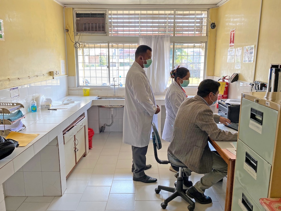 Scientists at WARUN's Pokhara site examine data in a laboratory.