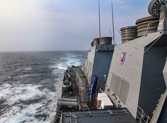 The Arleigh Burke-class guided-missile destroyer USS Benfold (DDG 65) transits the Taiwan Strait.