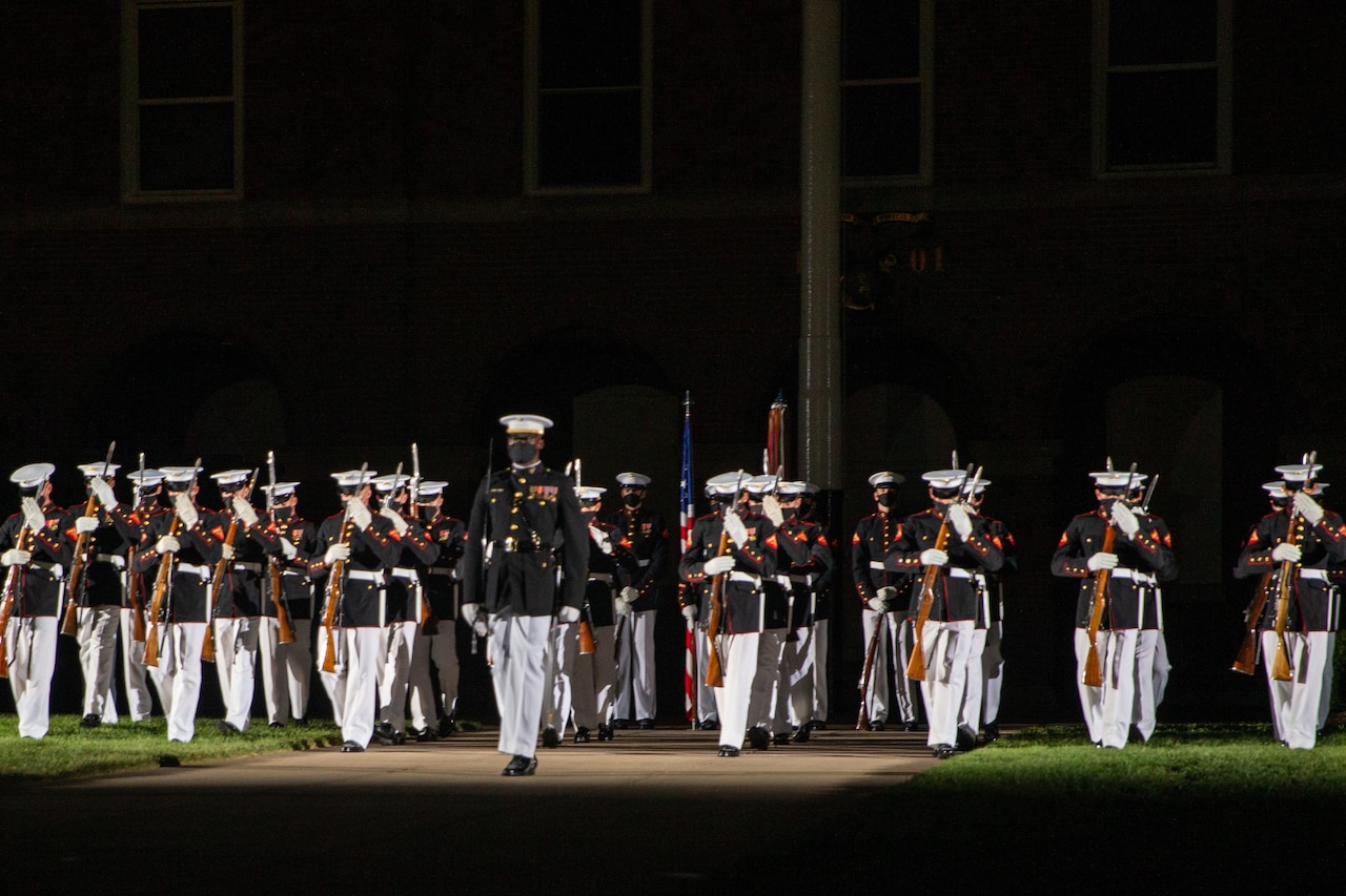 A platoon performs at night.