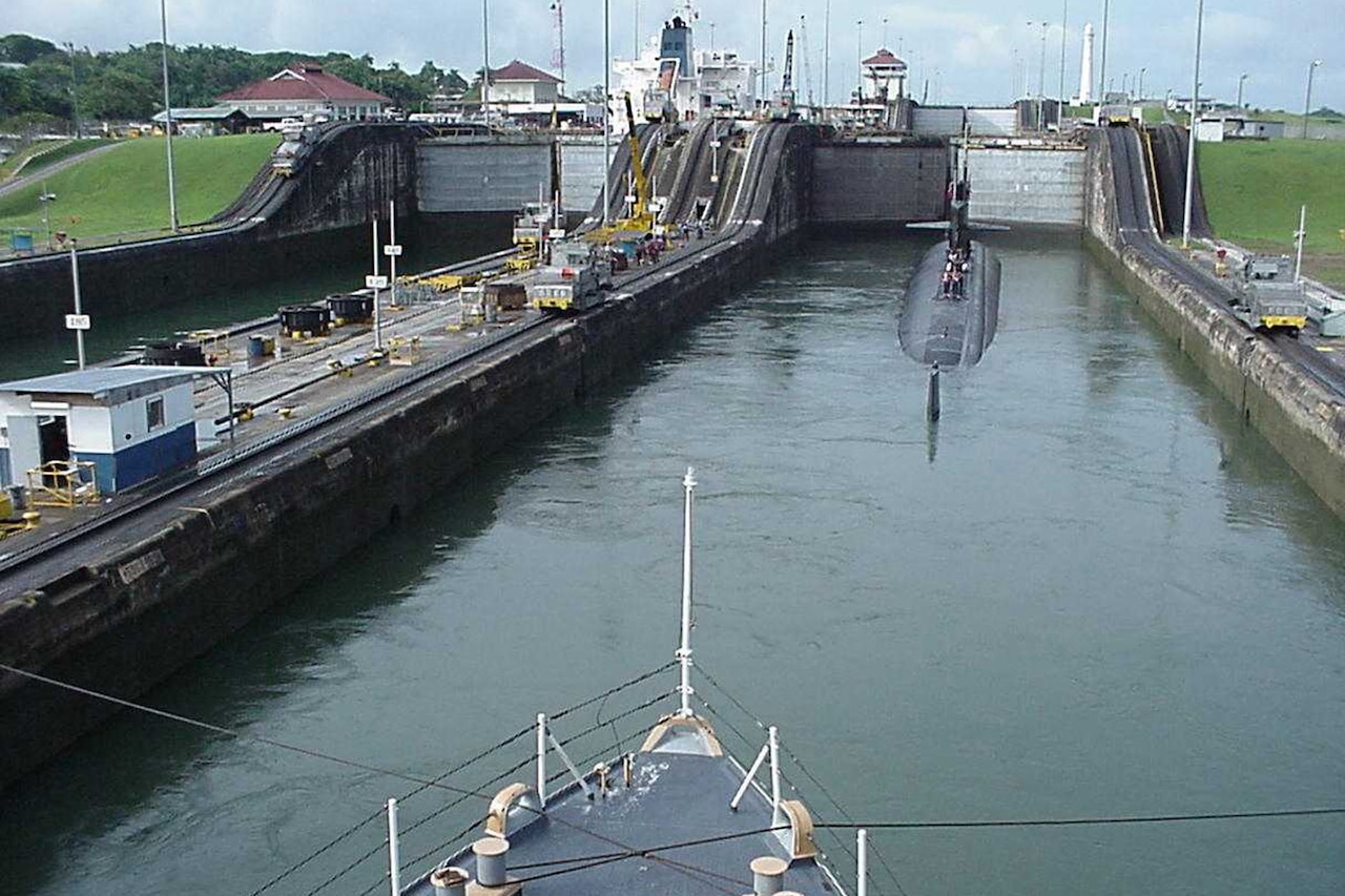 A ship goes through locks on a canal.