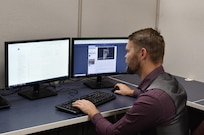IMAGE: Andrew “AJ” Rasure, strategic targeting communications analyst at Naval Surface Warfare Center Dahlgren Division.