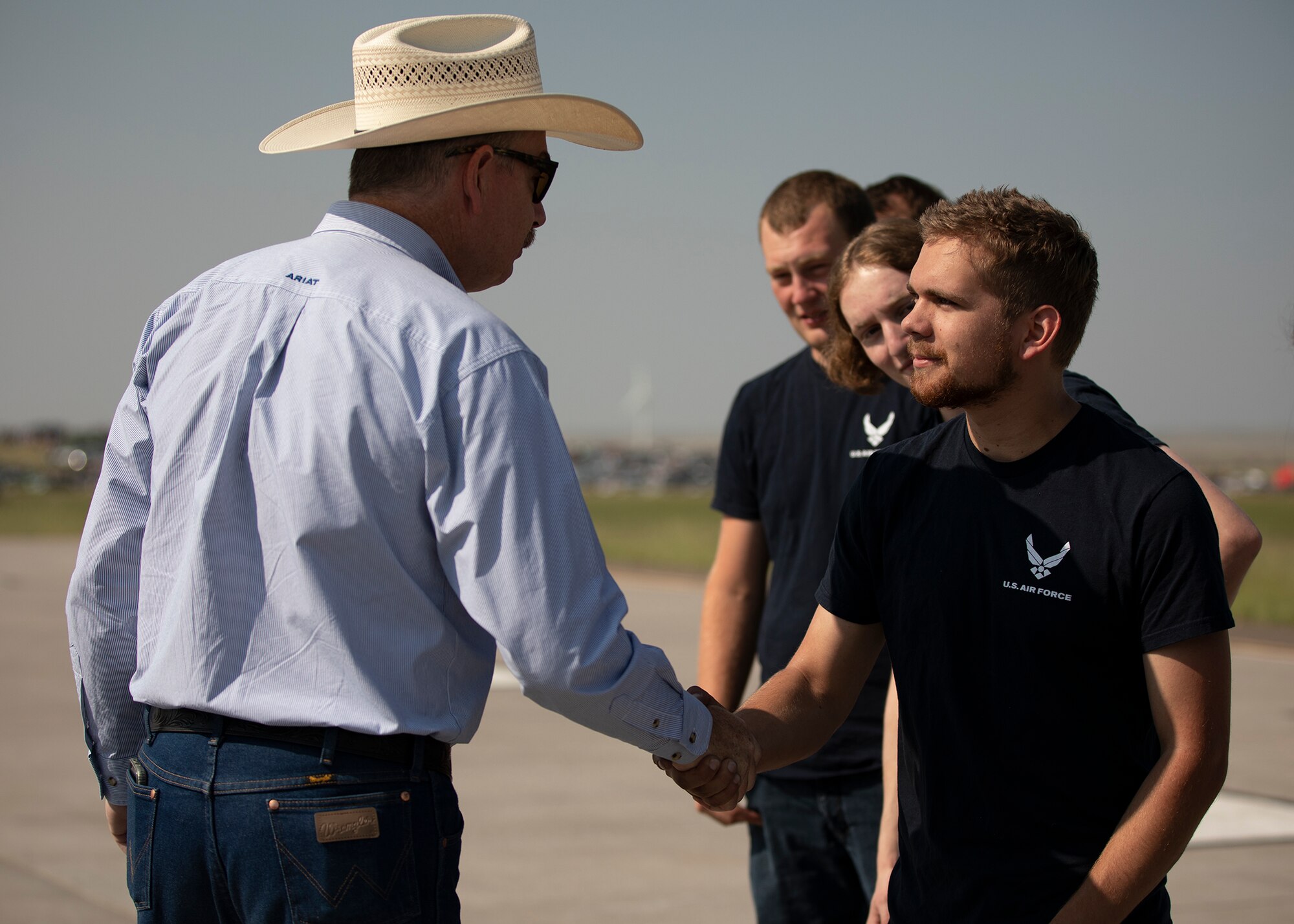 Cheyenne mayor Patrick Collins greets new Air Force recruits during the Wings over Warren air show July 28, 2021 on F.E. Warren Air Force Base, Wyoming. Wings over Warren is an annual air show scheduled in conjuction with Cheyenne Frontier Days. (U. S. Air Force photo by U.S. Army Staff Sgt. Ashley Smith)