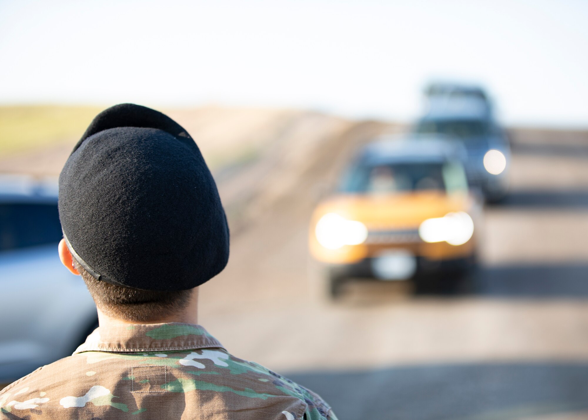 A defender oversees traffic entering base for the Wings over Warren air show July 28, 2021 on F.E. Warren Air Force Base, Wyoming. Wings over Warren is an annual air show scheduled in conjuction with Cheyenne Frontier Days. (U.S. Air Force photo by Wyoming Army National Guard Sgt. Travis Burnham)