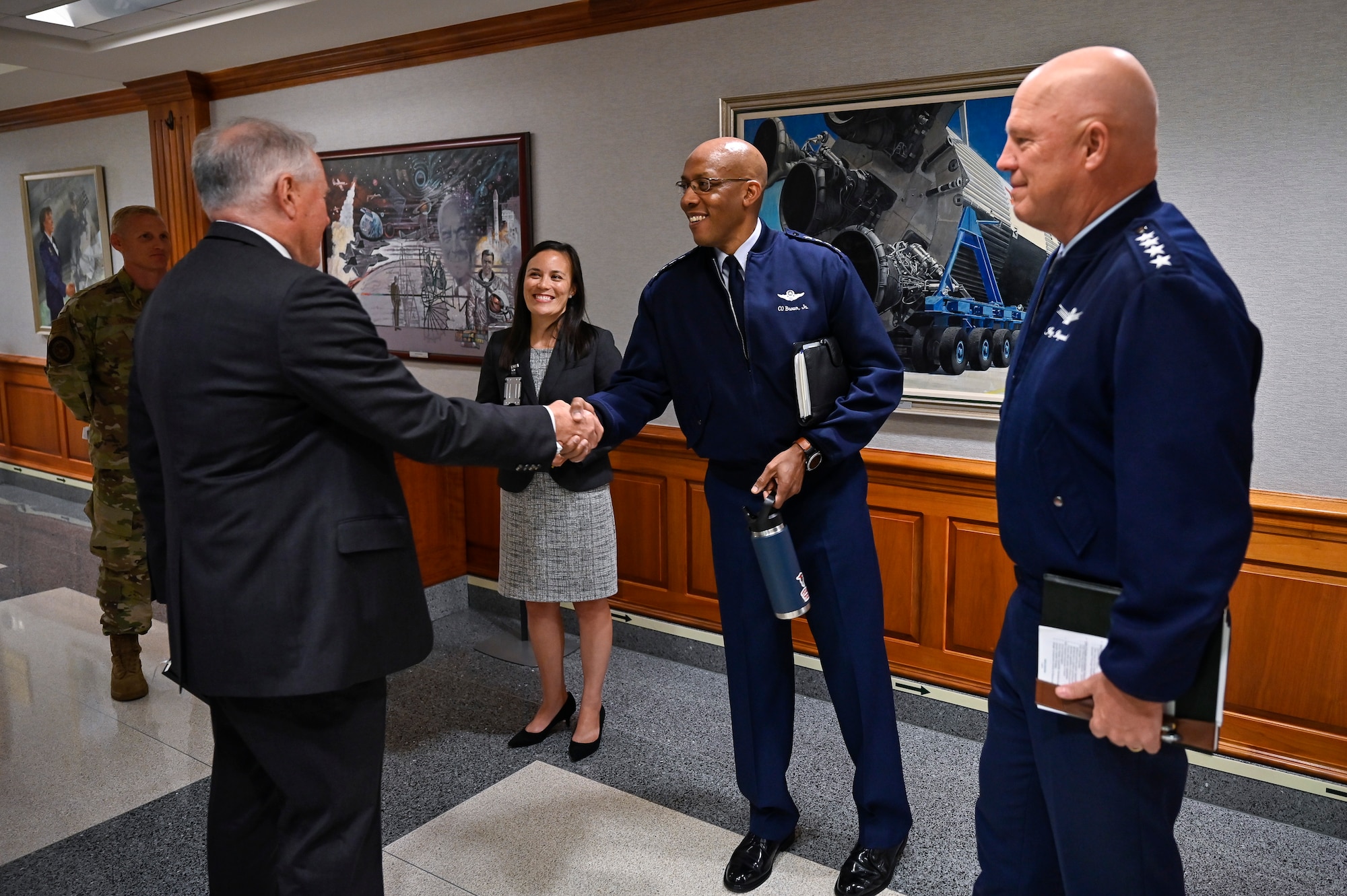 Secretary of the Air Force Frank Kendall shakes hands with Air Force Chief of Staff Gen. CQ Brown, Jr., before a meeting with Under Secretary of the Air Force Gina Ortiz Jones, Brown, and Chief of Space Operations Gen. John W. “Jay” Raymond at the Pentagon, Arlington, Va., July 28, 2021. (U.S. Air Force photo by Eric Dietrich)