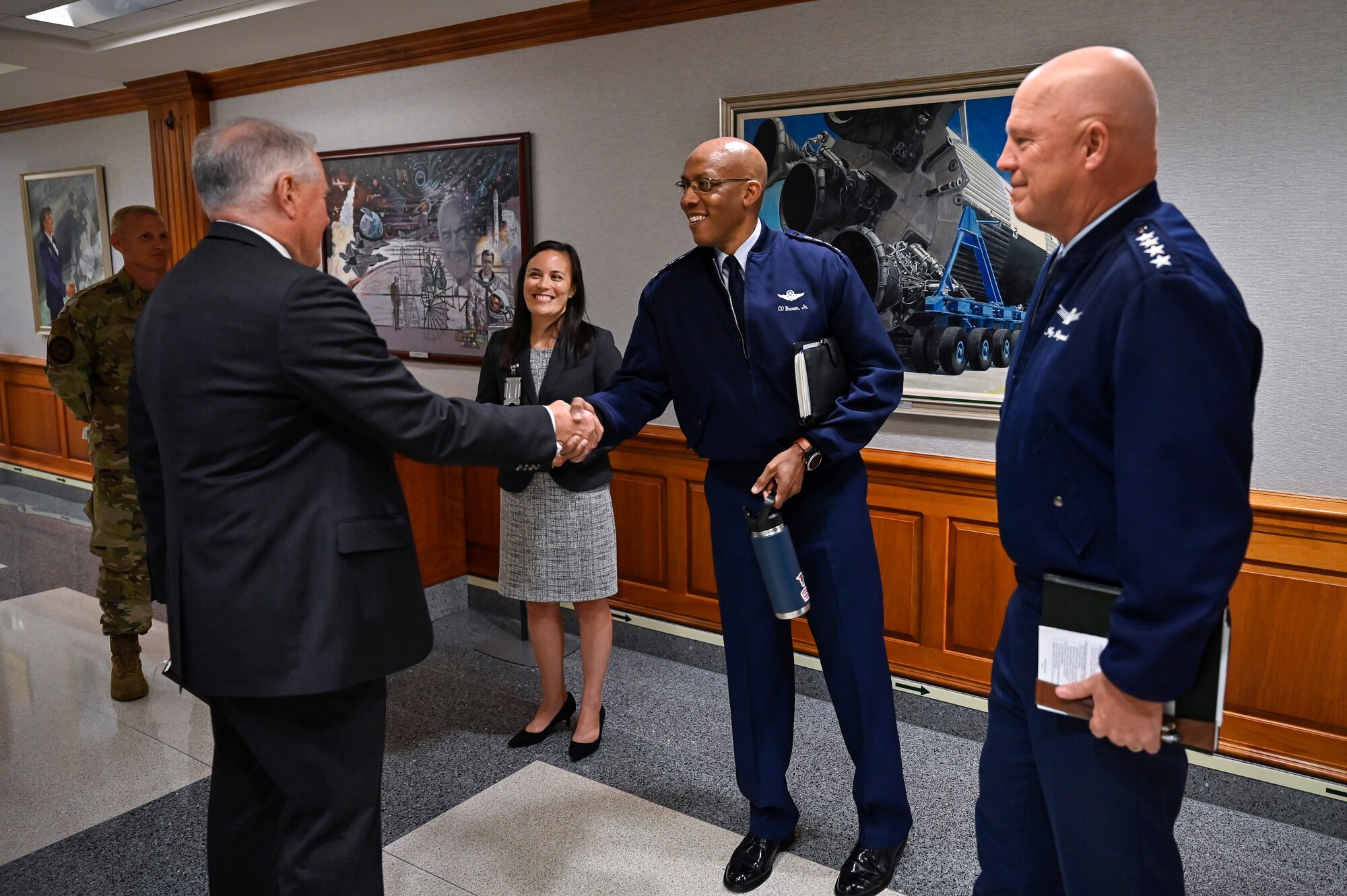 Secretary of the Air Force Frank Kendall shakes hands with Air Force Chief of Staff Gen. CQ Brown, Jr., before a meeting with Under Secretary of the Air Force Gina Ortiz Jones, Brown, and Chief of Space Operations Gen. John W. “Jay” Raymond at the Pentagon, Arlington, Va., July 28, 2021. (U.S. Air Force photo by Eric Dietrich)