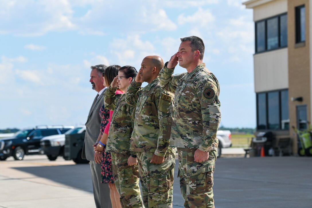 Leadership from Buckley Space Force Base, Colo., await the arrival of U.S. Marine Corps Gen. Kenneth F. McKenzie Jr., the U.S. Central Command commander, July 27, 2021, on the flightline at Buckley SFB.