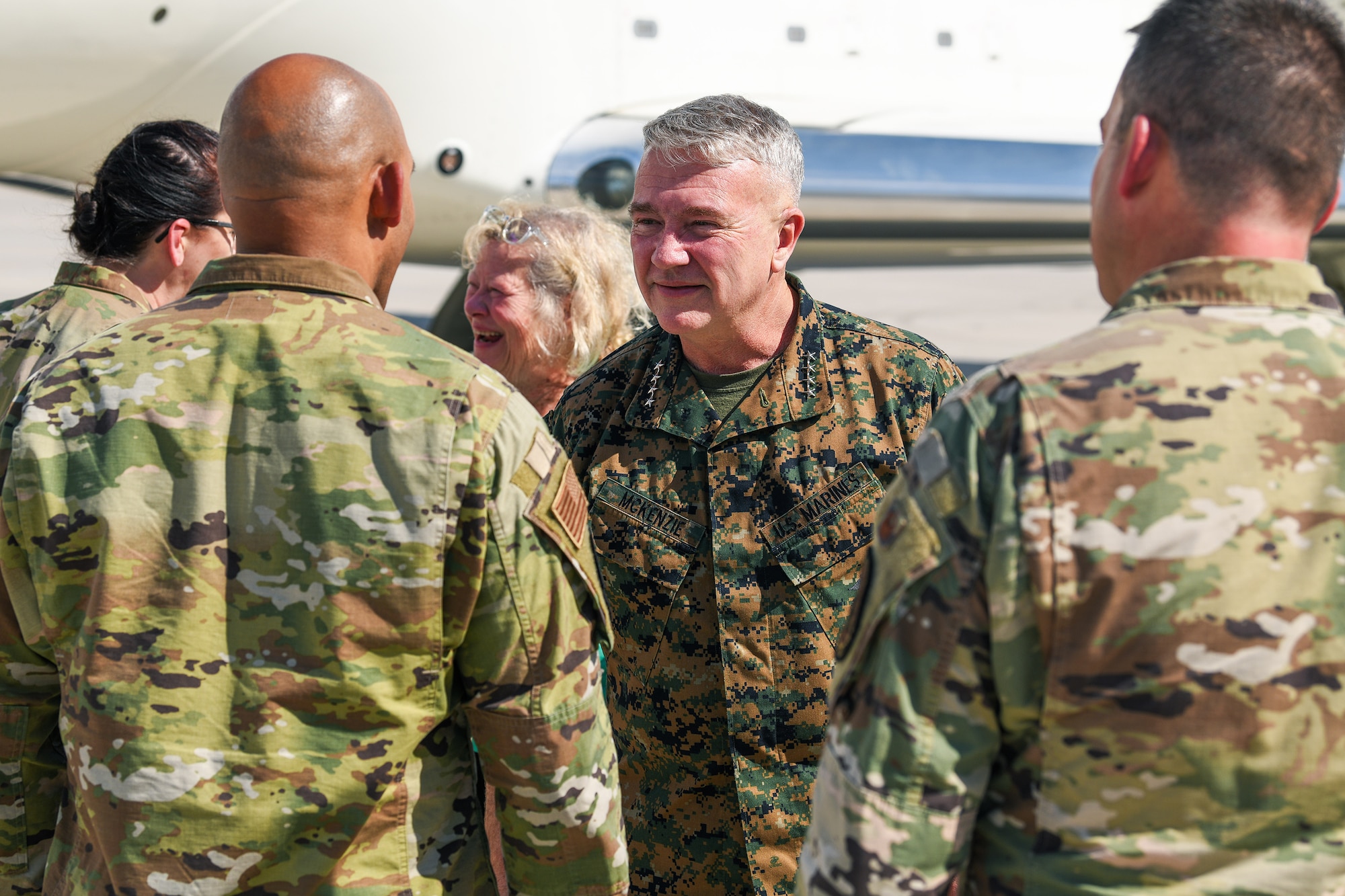 U.S. Air Force Chief Master Sgt. Byron Phillips, the Buckley Garrison acting command chief, greets U.S. Marine Corps Gen. Kenneth F. McKenzie Jr., the U.S. Central Command commander, July 27, 2021, on the flightline at Buckley Space Force Base, Colo.