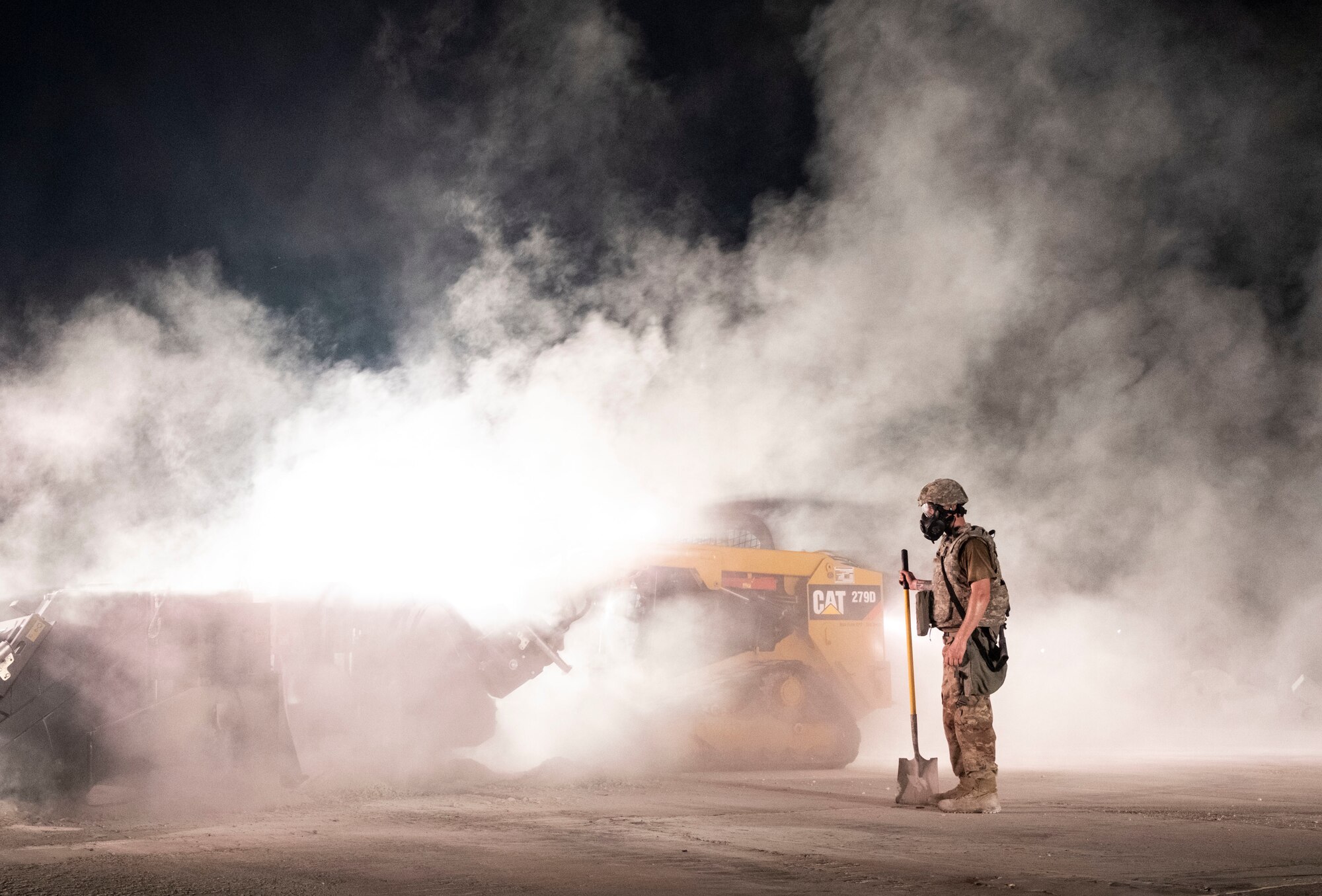 An Airman assigned to the 8th Civil Engineer Squadron shovels dirt and concrete during Rapid Airfield Damage Repair training at Kunsan Air Base, Republic of Korea