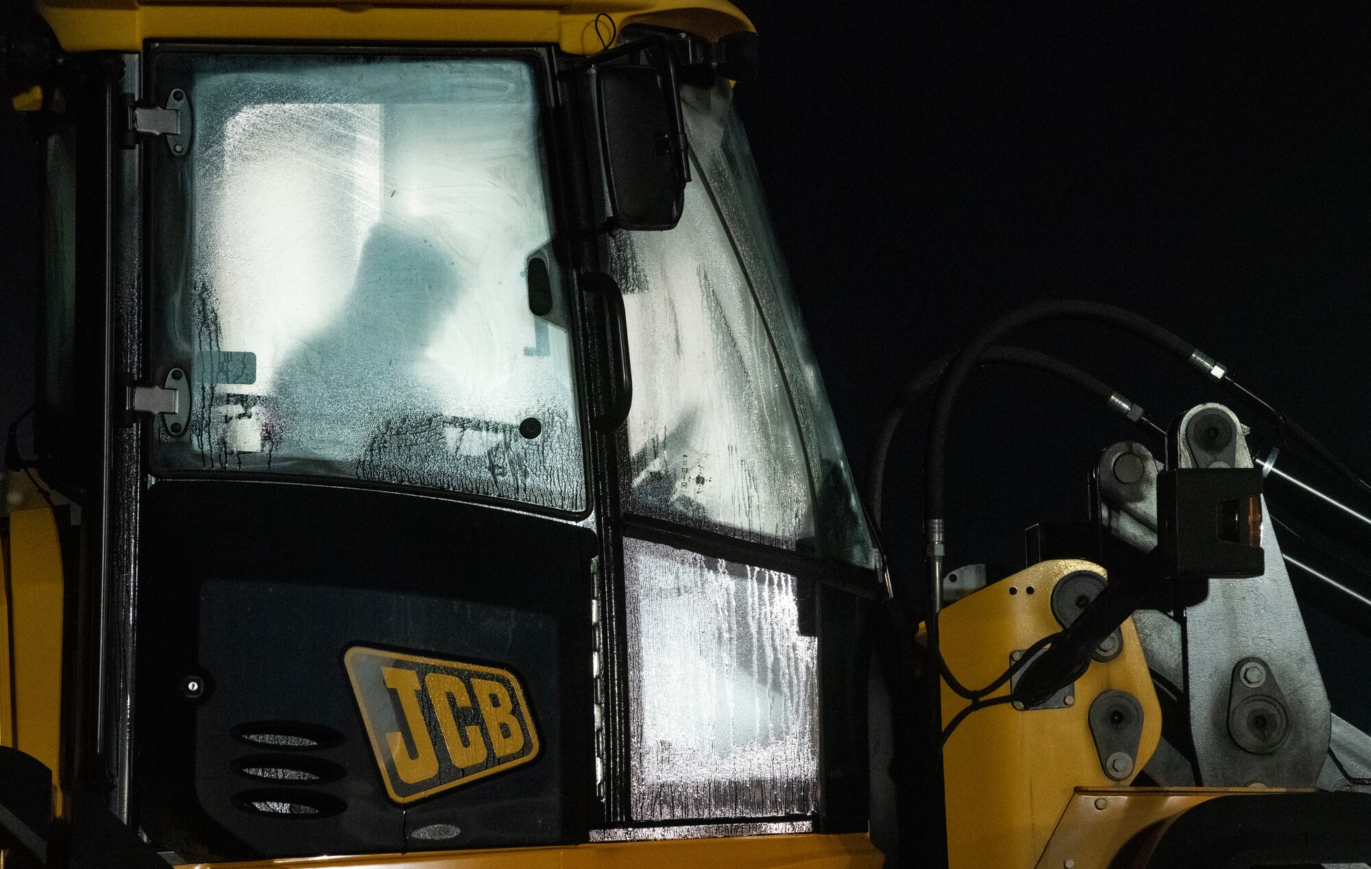 An Airman assigned to the 8th Civil Engineer Squadron waits to clear debris away from a simulated damaged area created during a Rapid Airfield Damage Repair training at Kunsan Air Base, Republic of Korea