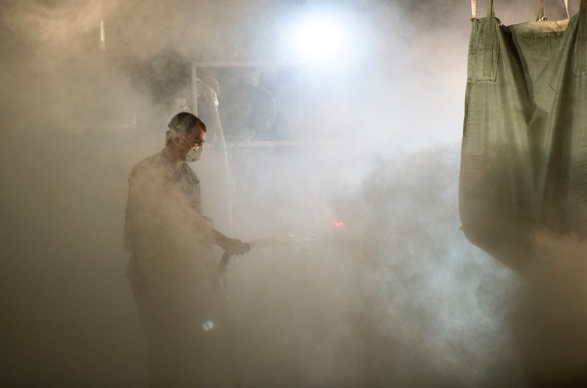 Airmen assigned to the 8th Civil Engineer Squadron fill a crater with water and concrete during a Rapid Airfield Damage Repair training at Kunsan Air Base, Republic of Korea