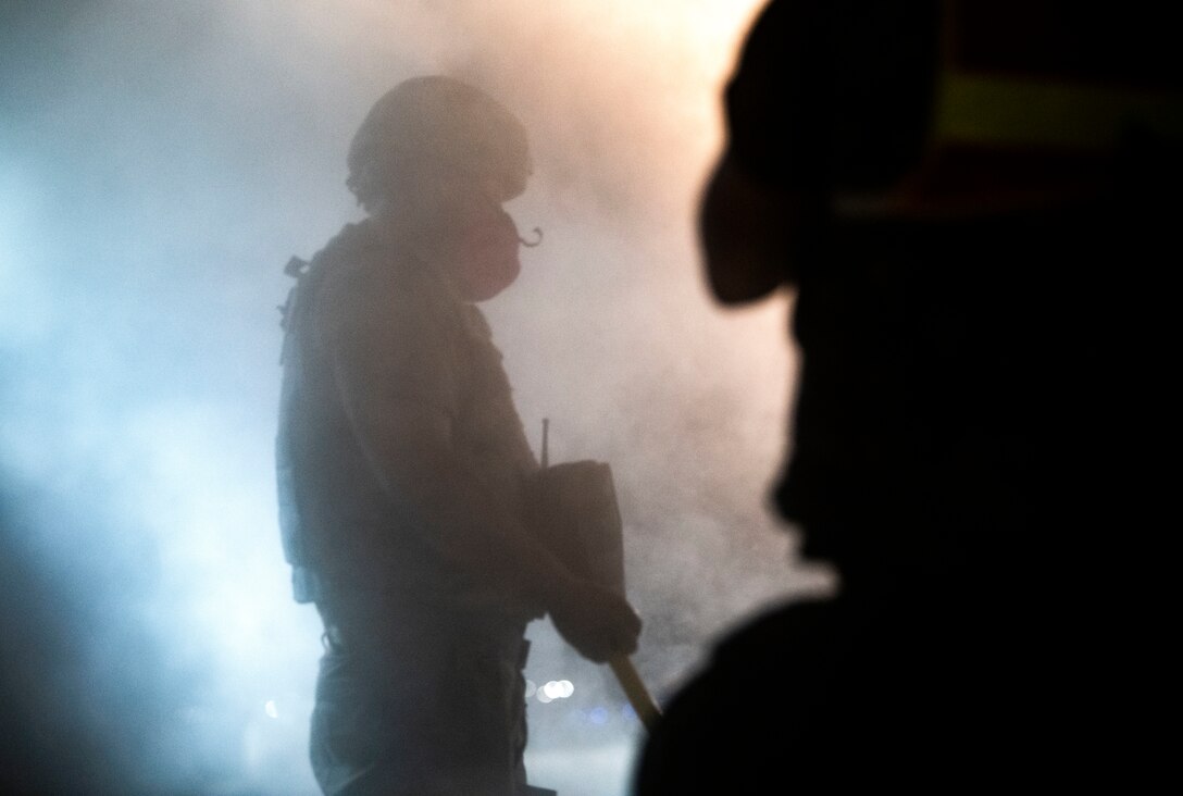 Airmen assigned to the 8th Civil Engineer Squadron fill a crater with water and concrete during a Rapid Airfield Damage Repair training at Kunsan Air Base, Republic of Korea