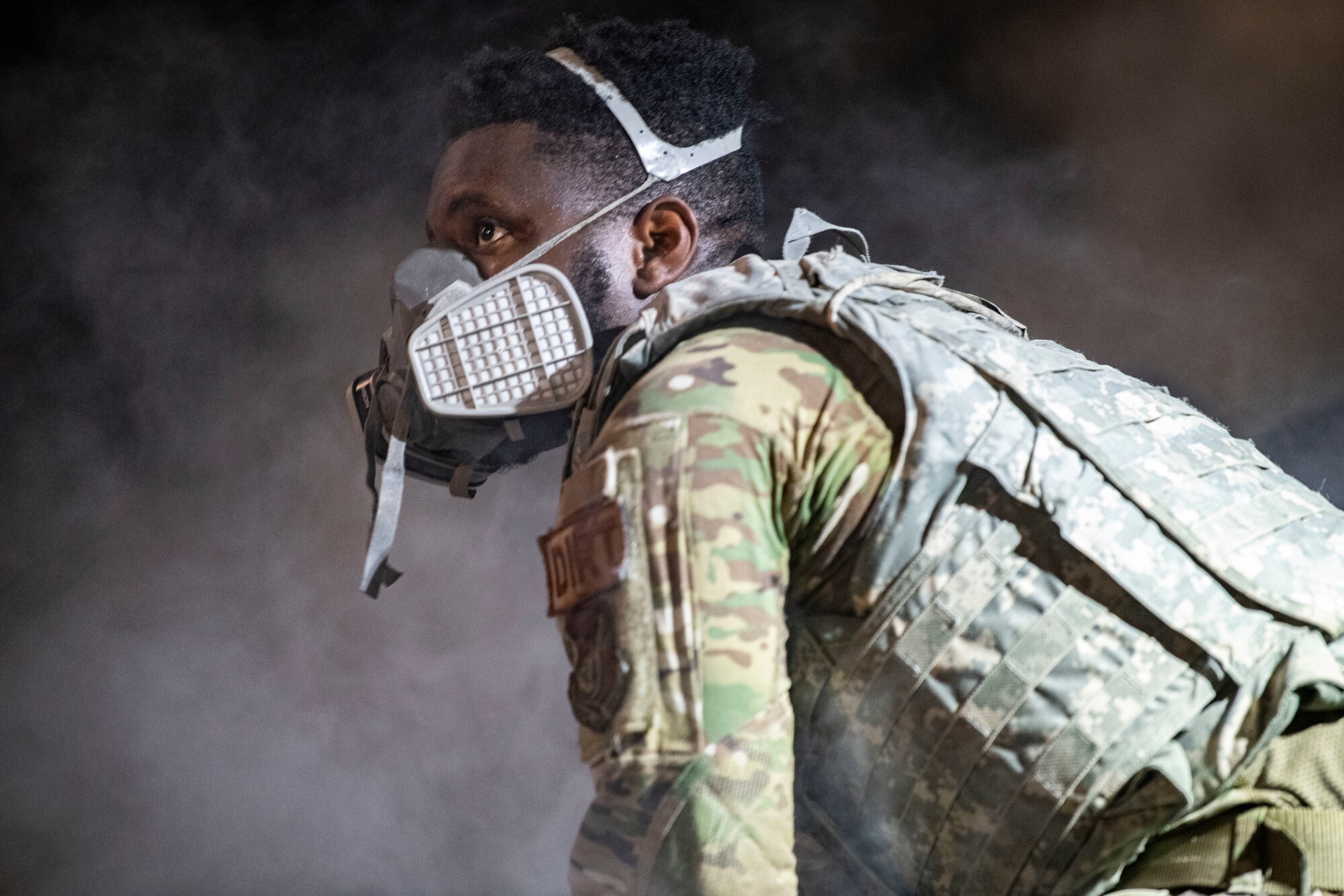 Senior Airman Thaddeus White, 8th Civil Engineer Squadron pavements and heavy equipment journeyman, helps fill a crater with water and concrete during a Rapid Airfield Damage Repair training at Kunsan Air Base, Republic of Korea