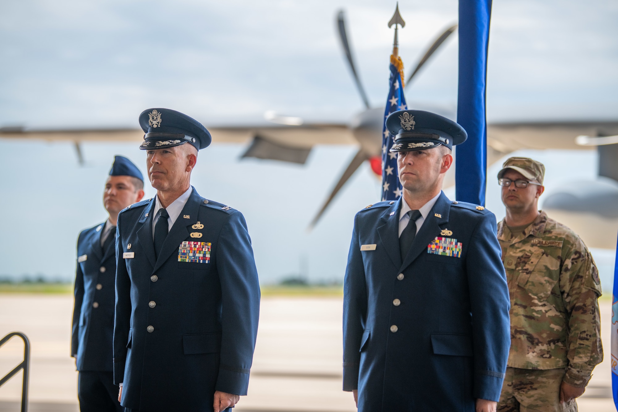 U.S. Air Force Col. Bernabe Whitfield, 27th Special Operations Maintenance Squadron commander, and U.S. Air Force Maj. Joshua Isom, 27th Special Operations Munitions Squadron commander stand for the squadron activation ceremony at Cannon Air Force Base, N.M., July 27, 2021. The 27 SOMUNS was activated recently to align with the Air Force Special Operations Command's strategic focus. (U.S. Air Force photo by Senior Airman Marcel D. Williams)