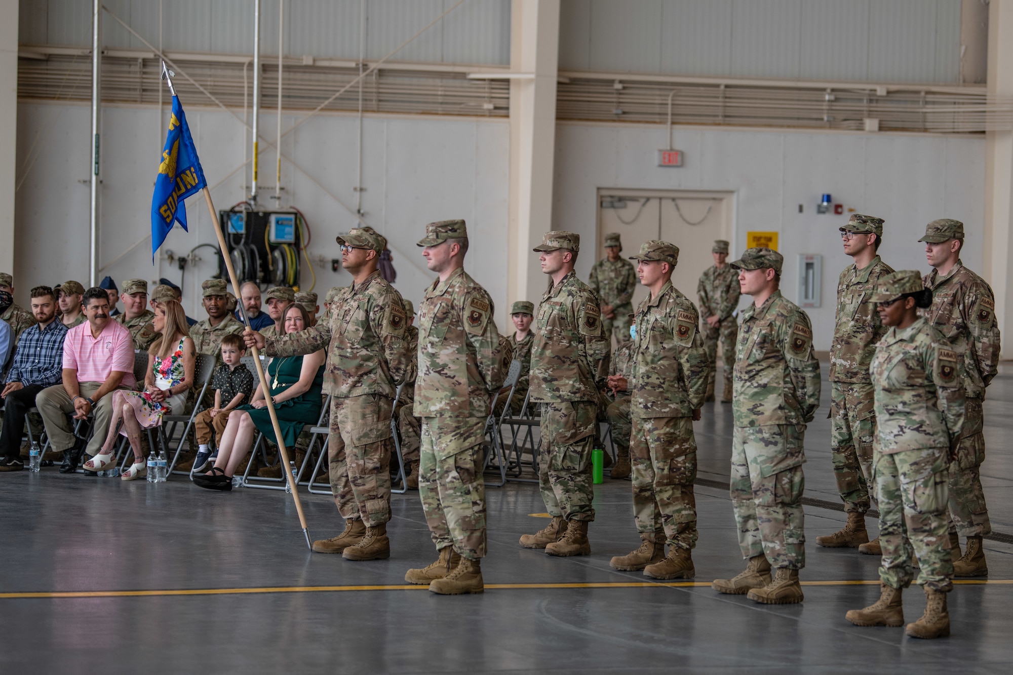 Members of the 27th Special Operations Munitions Squadron stand in formation for the 27 SOMUNS activation ceremony at Cannon Air Force Base, N.M., July 28, 2021. The 27 SOMUNS was activated recently to align with the Air Force Special Operations Command's strategic focus. (U.S. Air Force photo by Senior Airman Marcel D. Williams)