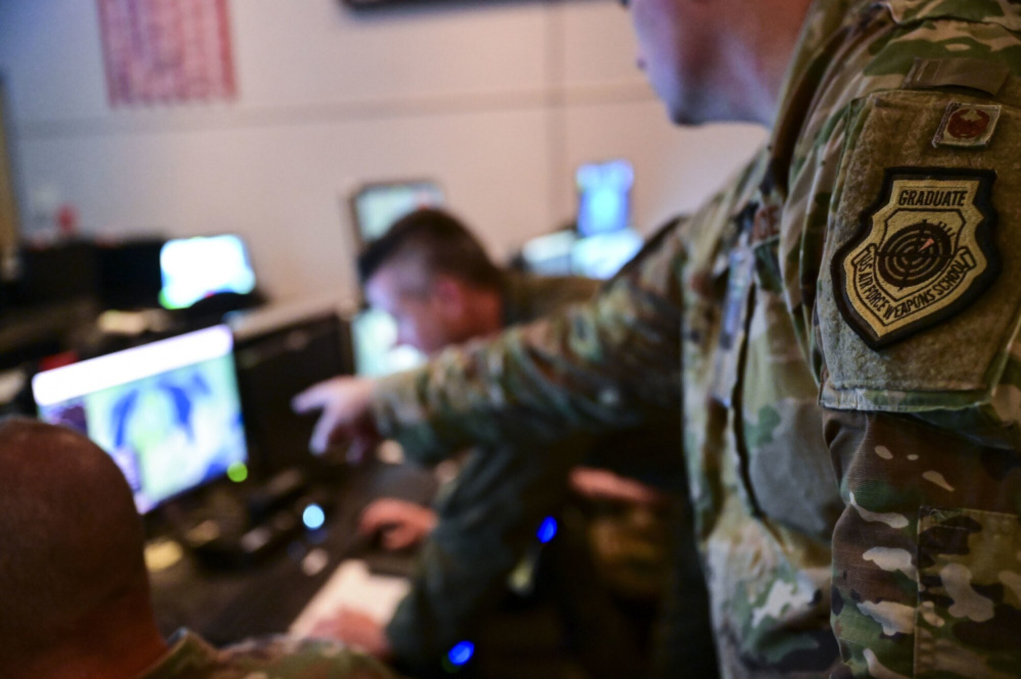 Airmen from the New York, Washington and Maryland Air National Guard monitor aircraft during the Global Information Dominance Experiment 3 in conjunction with the Architecture Demonstration and Evaluation 5 event at the 601st Air Operation Center on Tyndall Air Force Base, Fla., July 14, 2021. North American Aerospace Defense Command and U.S. Northern Command, NORAD and USNORTHCOM, in partnership with all 11 Combatant Commands, led the third in a series of Global Information Dominance Experiments designed to rapidly develop the capabilities required to increase deterrence options in competition and crisis through a data-centric software-based approach. GIDE events combine people and technology to innovate and accelerate system development for domain awareness, information dominance, decisional superiority and global integration. The GIDE 3 experiment was executed in conjunction with the Department of the Air Force's Chief Architect Office as part of their fifth Architecture Demonstration and Evaluation event (ADE 5), and the Joint Artificial Intelligence Center. (U.S. Air Force photo by Staff Sgt. Nicholas Byers)